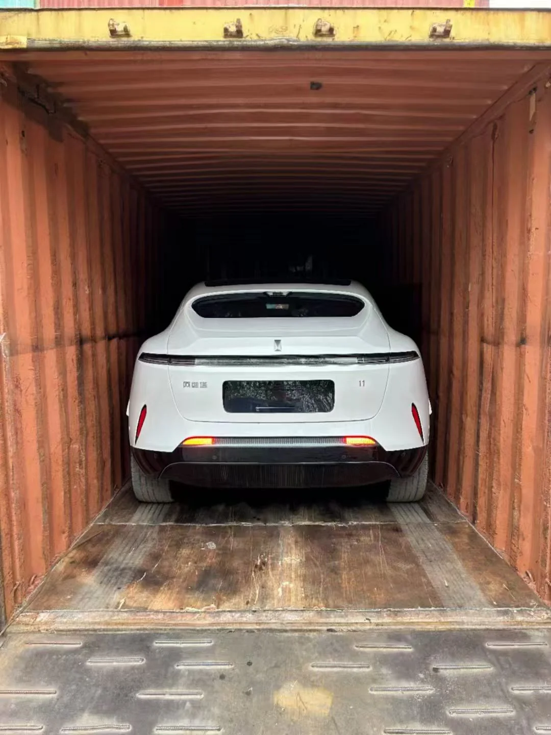 Car safely loaded inside shipping container for international transport