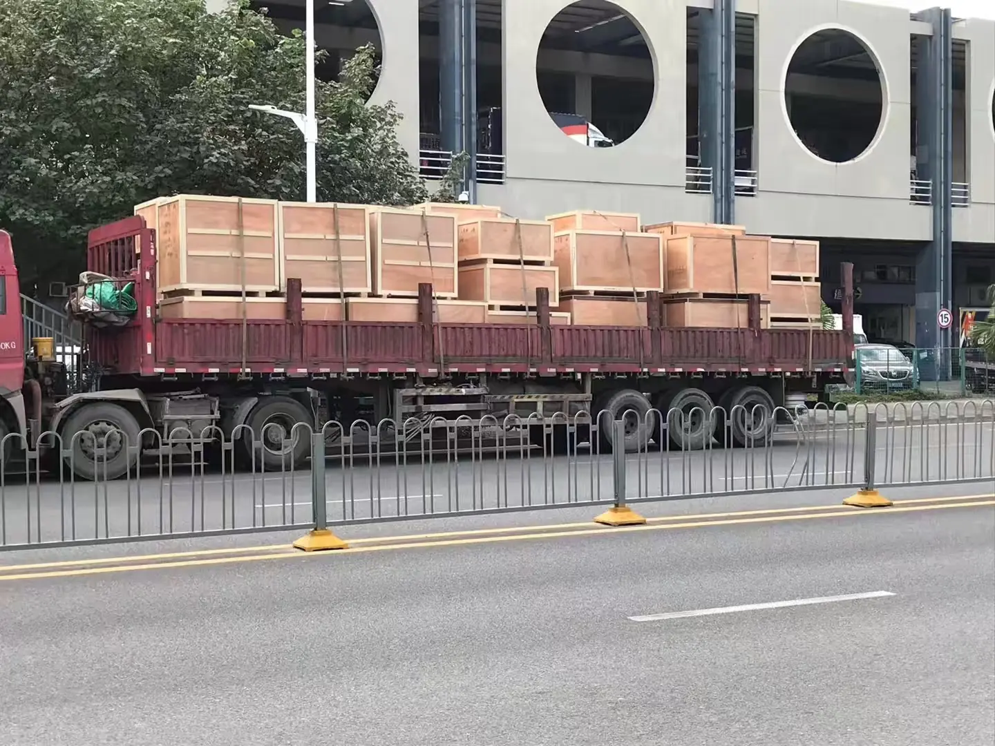 Flatbed truck carrying wooden crates for domestic transport in China