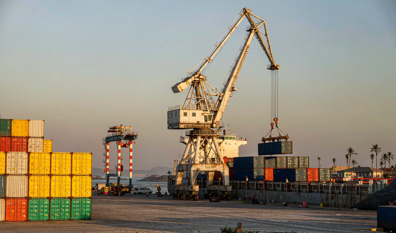 Container terminal at the Port of Toamasina Madagascar with gantry cranes and stacked containers - shipping from China to Madagascar by CargoSolid
